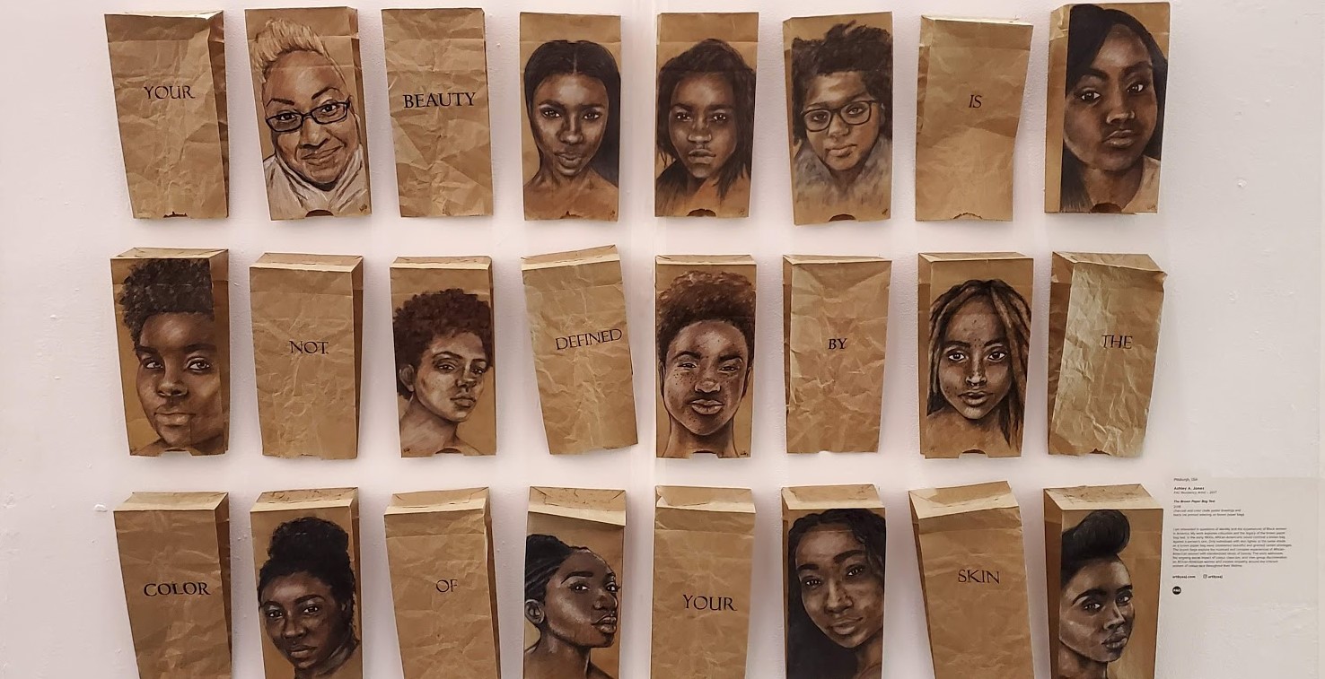 Pictured above is The Brown Paper Bag Test (2016-2018) by Ashley A. Jones, which speaks to the painful legacy of colourism among African-Americans. The “paper bag test” was used as a marker of privilege and beauty—if you were lighter than the paper bag, you passed the test. The text across the bags reads: “YOUR BEAUTY IS NOT DEFINED BY THE COLOR OF YOUR SKIN.” Ashley was my studio mate when we completed the FAC Residency together in 2017.