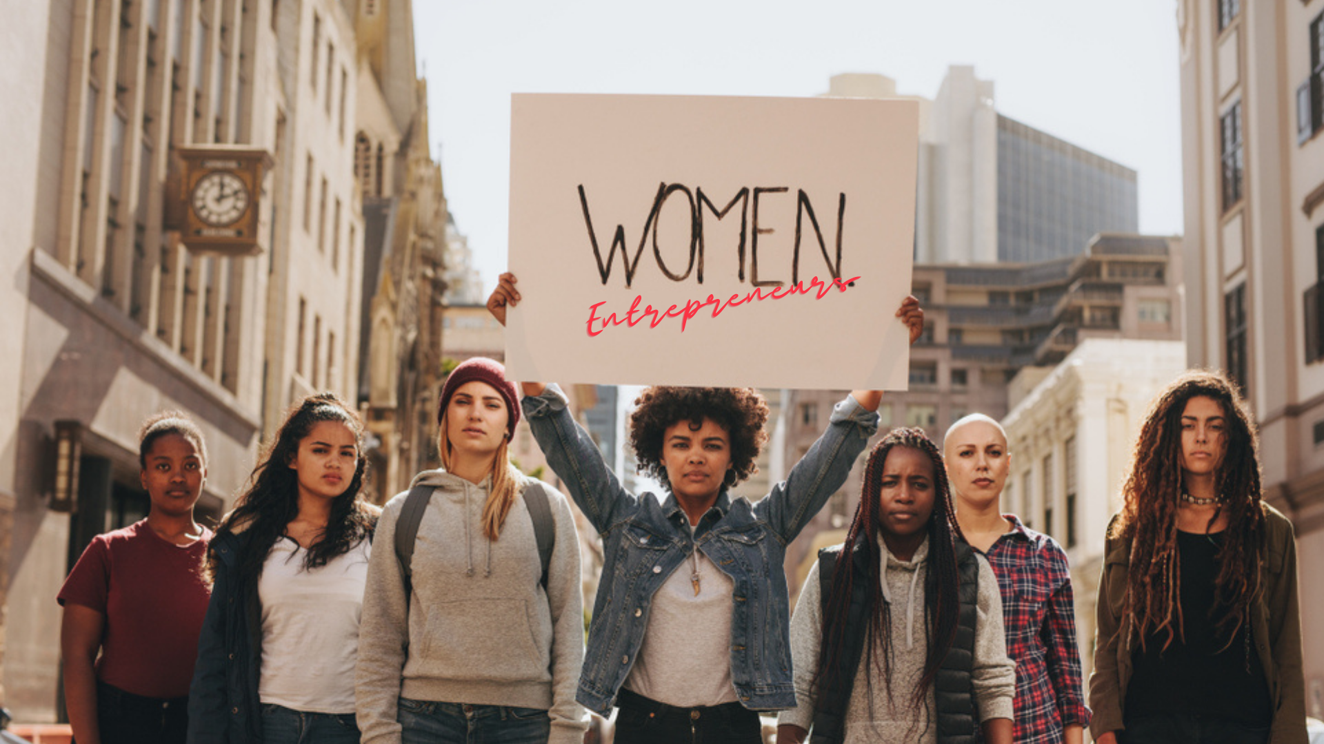 Photo of six women holding a Women Entrepreneurs sign to illustrate the article