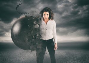 woman standing against a wrecking ball